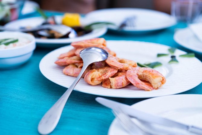 Santorini All-inclusive Catamaran Cruise with Thirassia Stop - The Stunning Setting of Santorini’s Red and White Beaches