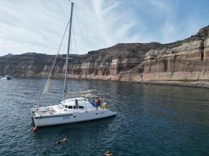 Santorini: Catamaran Cruise with Greek BBQ and Drinks - Relaxing at Mesa Pigadia Beach
