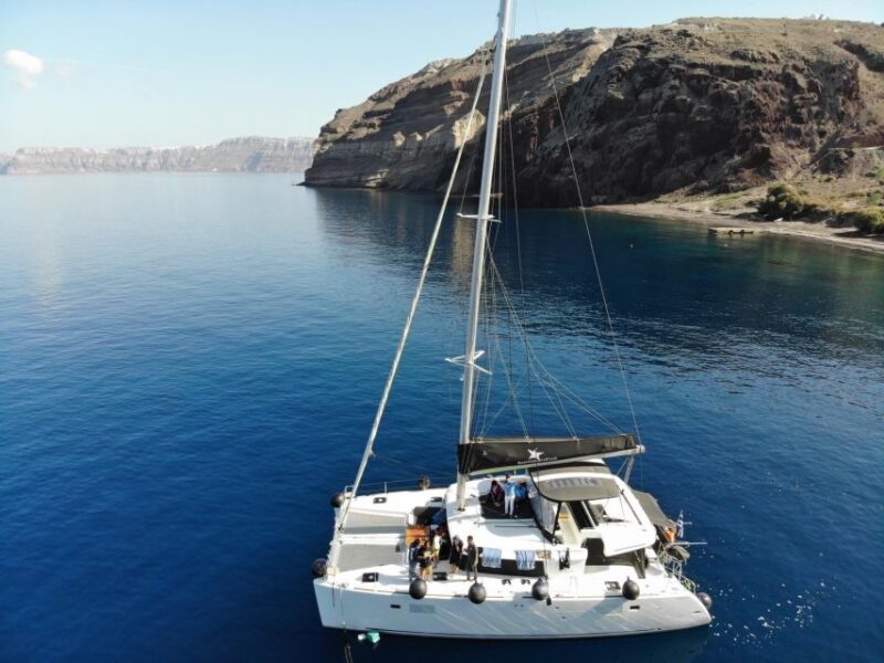 Santorini: Catamaran Cruise with Meal & Open Bar - Practicalities and Logistics: Pickup, Safety, and Group Size