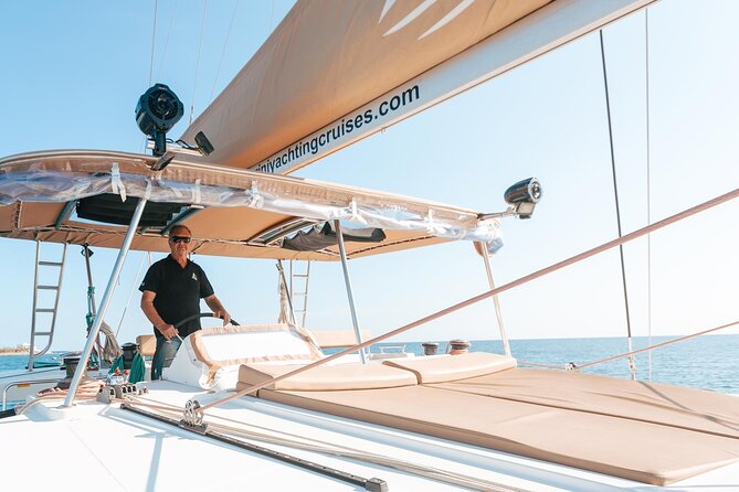 Santorini Catamaran Day Cruise: Lunch, BBQ, Open Bar, Transfers - Onboard Food, Drinks, and Atmosphere