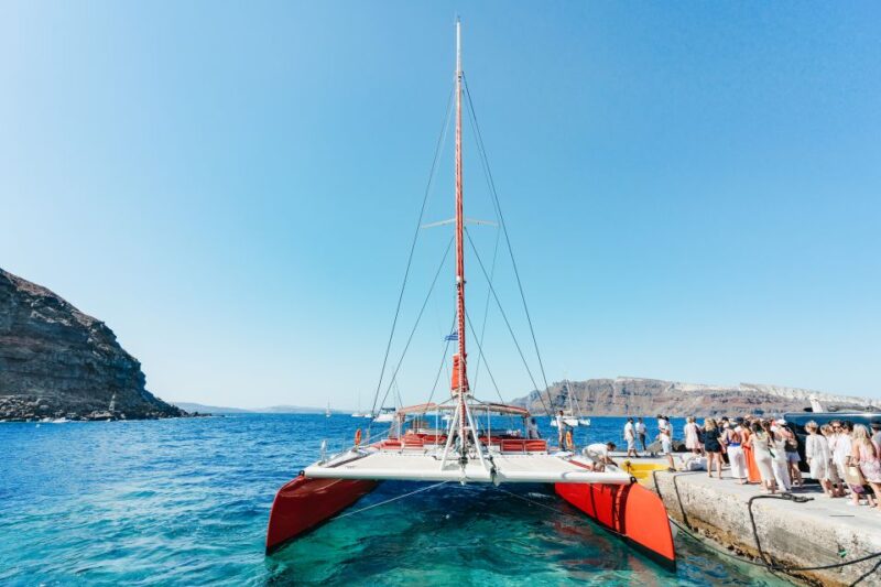 Santorini: Catamaran Tour with BBQ Dinner, Drinks, and Music - Exploring Santorinis Iconic Coastline and Beaches