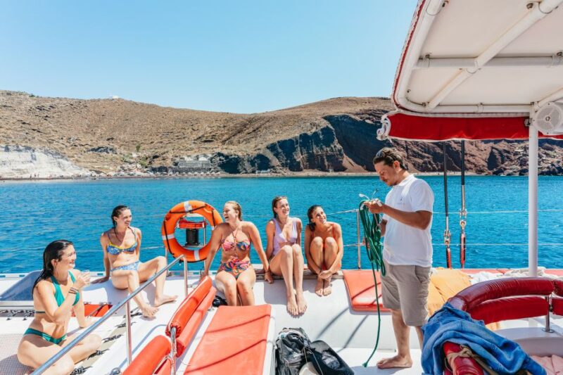 Santorini: Catamaran Tour with BBQ Dinner, Drinks, and Music - Savoring Santorini’s Sunset and Ocean Views