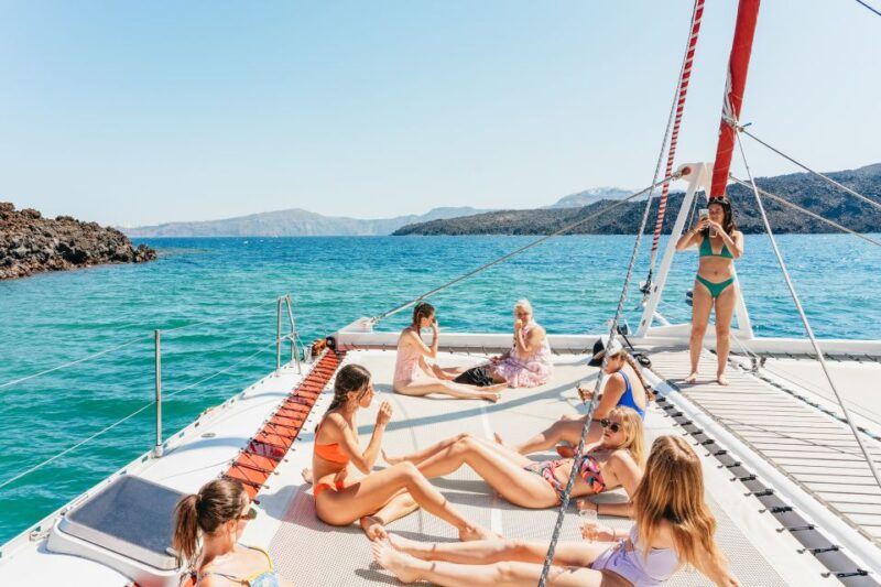 Santorini: Catamaran Tour with BBQ Dinner, Drinks, and Music - Onboard Comforts and Practical Details