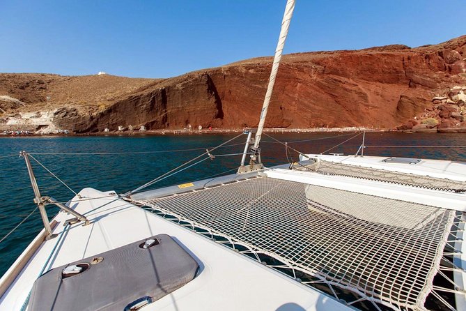 Santorini Half Day Catamaran Private Cruise incl. Meal, Drinks & Free Transport - The On-Board Experience: Meals, Drinks, and Snorkeling