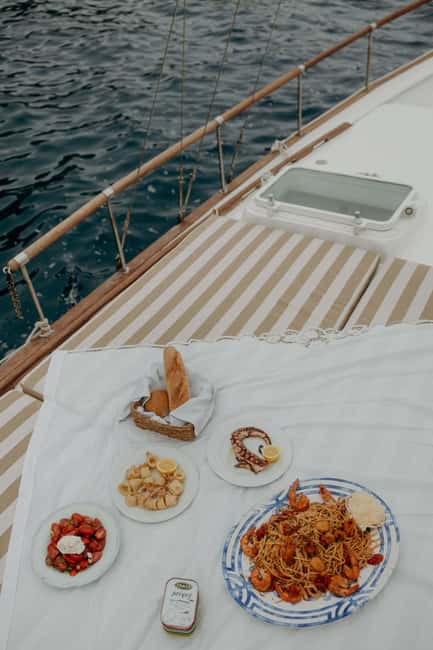 Santorini: Ios Island Overnight Sailing Trip with Meals - Dining Aboard: An Authentic Greek Culinary Experience