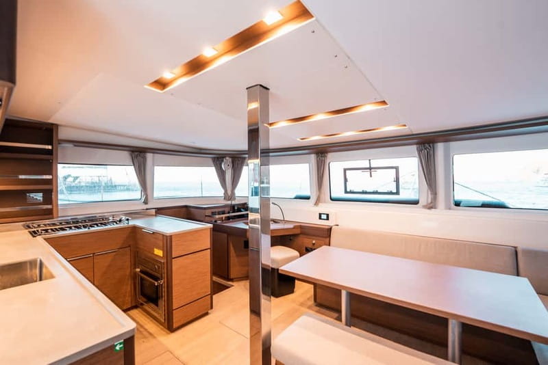 Santorini: Majestic Catamaran Cruise with Meal and Drinks - Enjoying a Gourmet Greek Meal on Deck