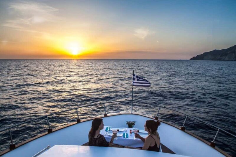 Santorini: Motor Yacht Sunset Cruise with 5-Course Dinner - Stops for Swimming: Volcano and Mesa Pigadia