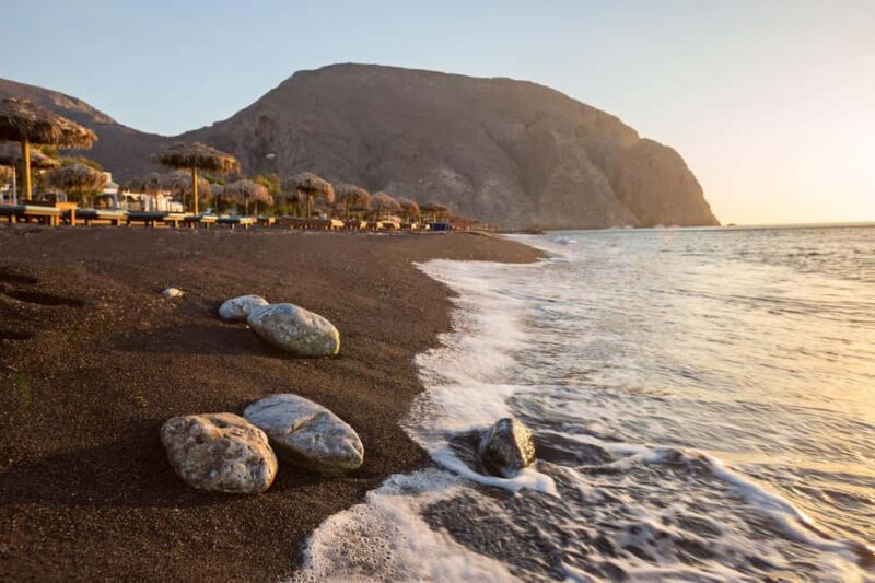 Santorini: Oia Walking Tour and Lighthouse Sunset with Wine - Relaxing at Perivolos Black Beach