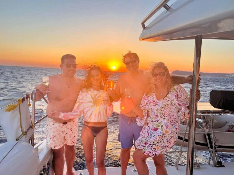 Santorini: Private Luxury Catamaran Cruise with Greek Meal - Visiting White Beach and Red Beach for Swimming and Sunbathing