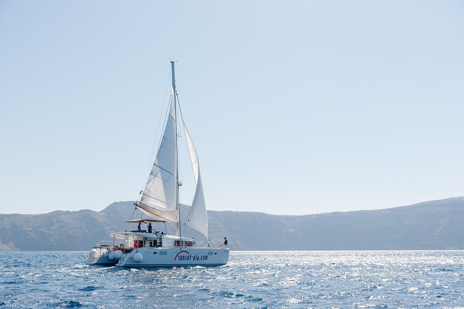Santorini Small-Group Catamaran Sailing Trip(BBQ,drinks, transfer) - The White Beach and Red Beach: Geological Wonders