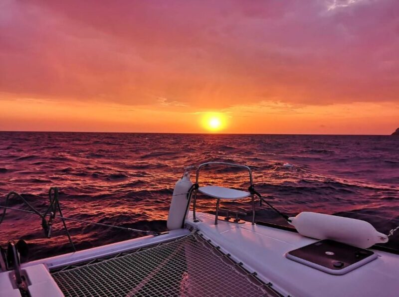 Santorini: Sunset Cruise with Greek Dinner and Transfer - Volcano Springs and the Magic of Santorini’s Volcanic Waters