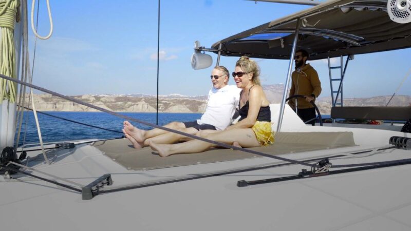 Santorini: Sunset Cruise with Greek Dinner and Transfer - Flexible Itinerary with Multiple Stops and Drop-offs