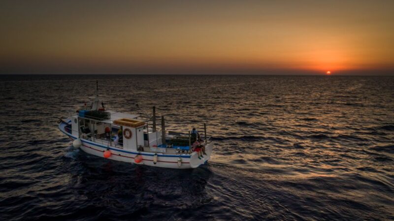 Santorini Sunset Fishing Trip with Dinner and Drinks - Savoring the Scenic Volcanic Landscape from the Sea