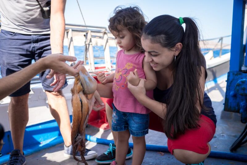 Santorini Sunset Fishing Trip with Dinner and Drinks - Helping to Prepare and Cook the Fresh Fish Dinner