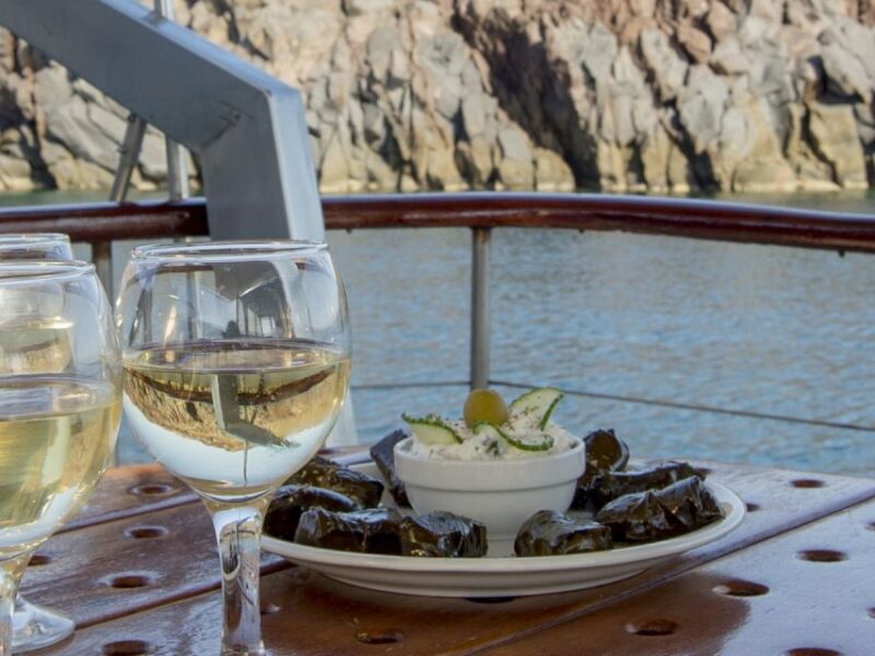 Santorini: Traditional Wooden Boat Tour with Meal and Wine - Visiting the Akrotiri Lighthouse and Volcano Area
