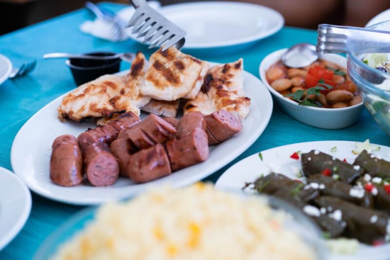 Santorini: Traditional Wooden Boat Tour with Meal and Wine - Tasting Greek Cuisine on Deck