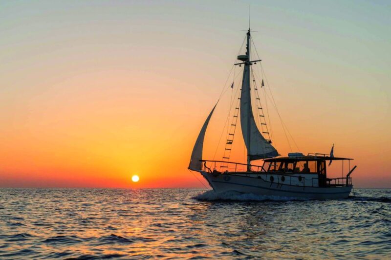 Santorini: Traditional Wooden Boat Tour with Meal and Wine - The Stops and Itinerary Details