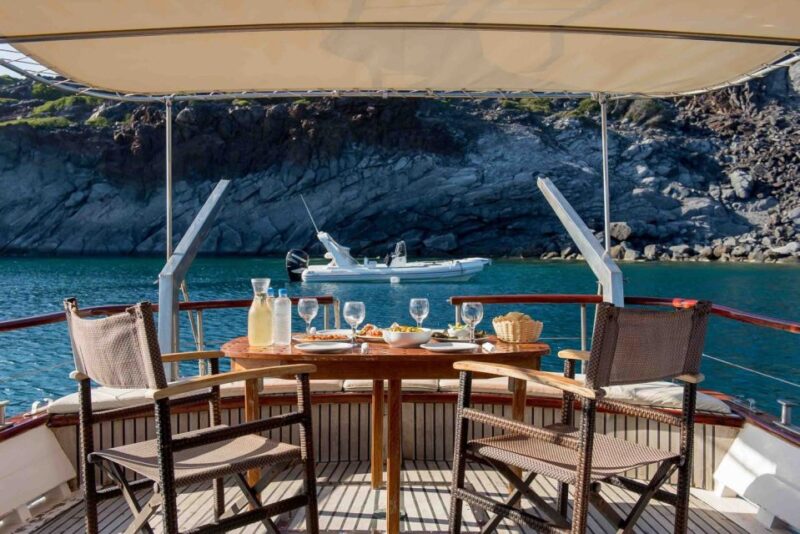 Santorini: Traditional Wooden Boat Tour with Meal and Wine - Logistics and Comfort