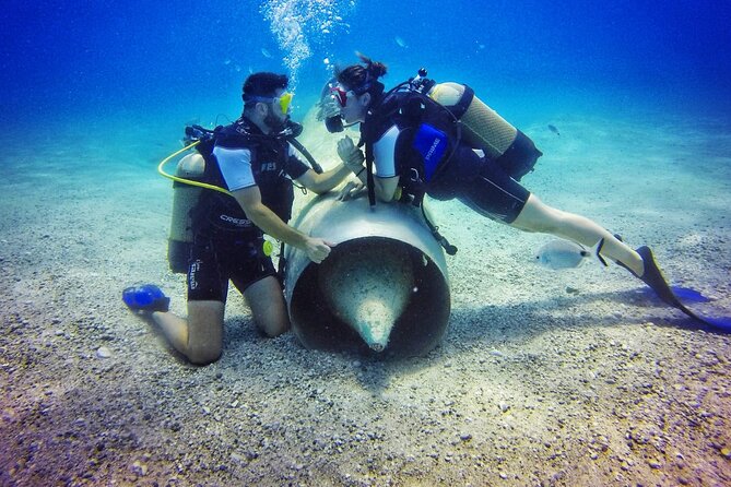 Scuba Diving in MIG-21 wreck - The MIG-21 Wreck: An Underwater Time Capsule at Drymades Beach
