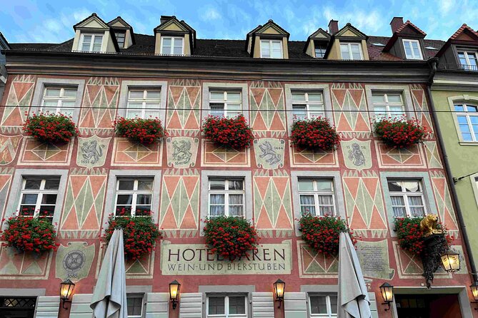 Self Guided Walking Tour through Old Town Freiburg - The Historical Merchants Hall and St. George Fountain