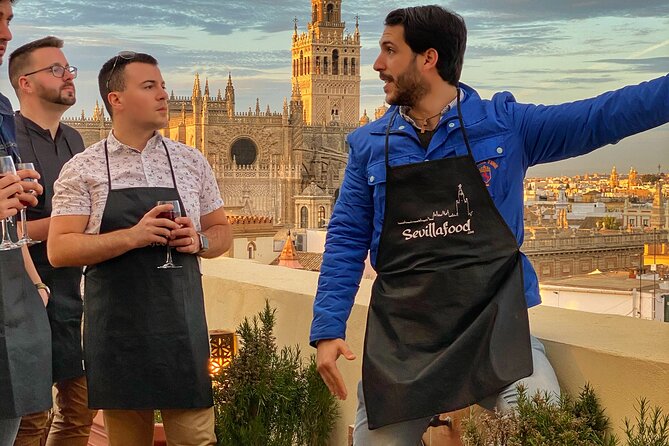 Sevilla: Panoramic Highlights Rooftop Tour & Paella Cooking Class - Savoring the Hearty Paella Feast