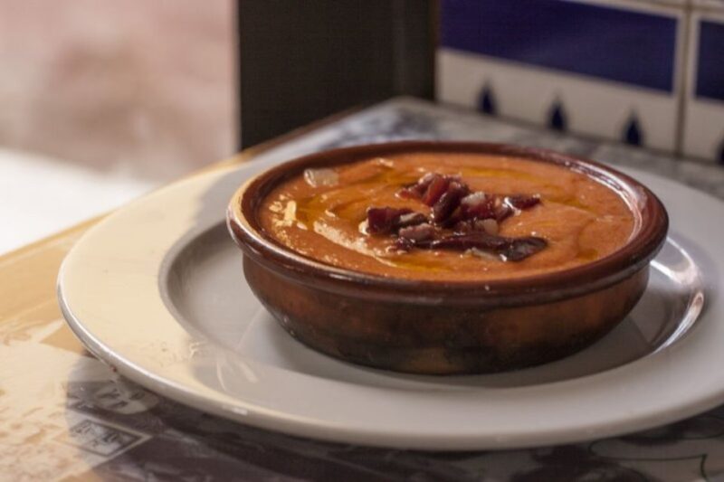 Seville: Food Tour with 10+ Tastings of Tapas, Ham, Churros - Exploring Sevillian Streets and Monuments