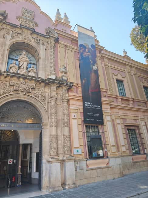 Seville: Guided Tour of the Art and Mercy Exhibition - Key Points