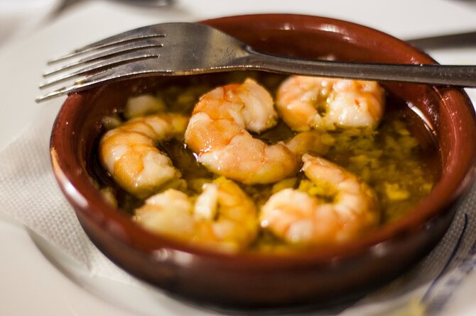 Seville Walking Food Tour With Secret Food Tours - The Guides Role and Tour Atmosphere