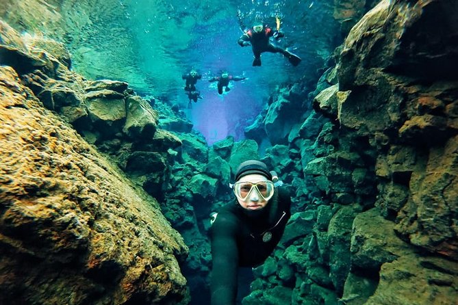 Silfra Wetsuit Snorkeling - Meet on location | Free Photos - Snorkeling in the Silfra Fissure Under Expert Supervision