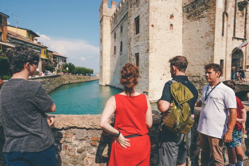 Sirmione: Village Highlights Walking & Lake Garda Boat Tour - Exploring the Ancient Grotte di Catullo and Thermal Springs
