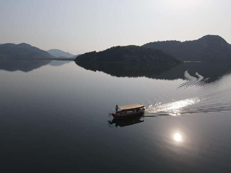 Skadar lake cruise - Virpazar - Kom monastery - Virpazar - View of Lake Skadar’s Connection to Albania and Mountain Vistas