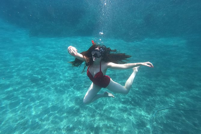 Small-Group Santorini Sea Caves Kayak Trip with Snorkeling & Picnic - Exploring the Unique Sea Caves and Blue Water Effects