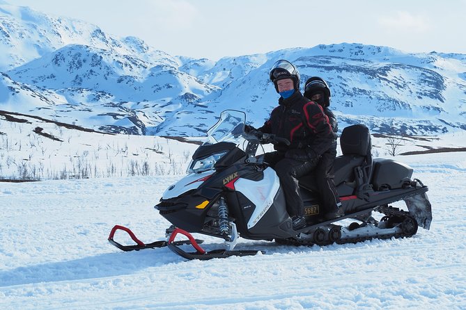 Snowmobile safari in the mountain plateau of Finnmarksvidda - Riding on the Frozen Lake and the Plateau’s Terrain