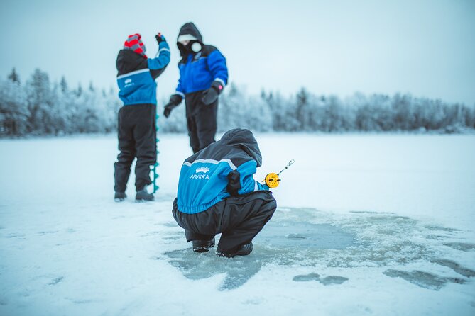 Snowmobiling and ice fishing in Apukka Resort, Rovaniemi - Ice Fishing on a Pristine Frozen Pond