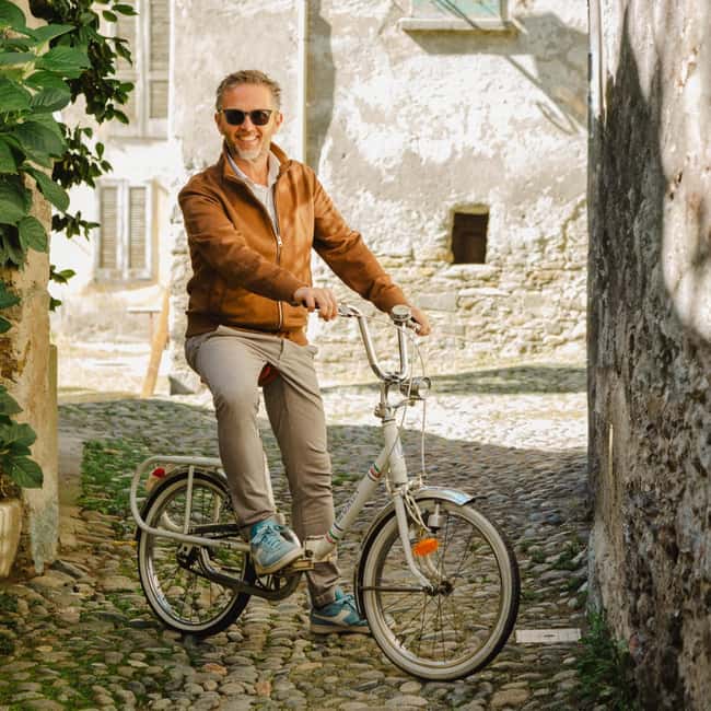 Sondrio and Surroundings: Tour with Vintage Tandem and Tasting - Riding Through Sondrio’s Historic Streets