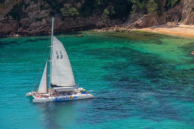 Special tour for groups sailing along the Costa Brava in a big catamaran. Food and drinks included. - Enjoying Swimming, Sunbathing, and Sea Games