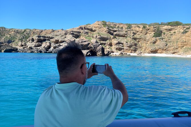 Speedboat excursion through the coves of northern Menorca - Visiting the Iconic Favaritx Lighthouse