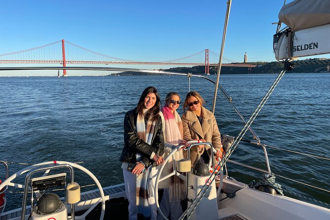 Sunset Boat Tour in Lisbon with Wine - Sipping Wine and Enjoying the Sunset