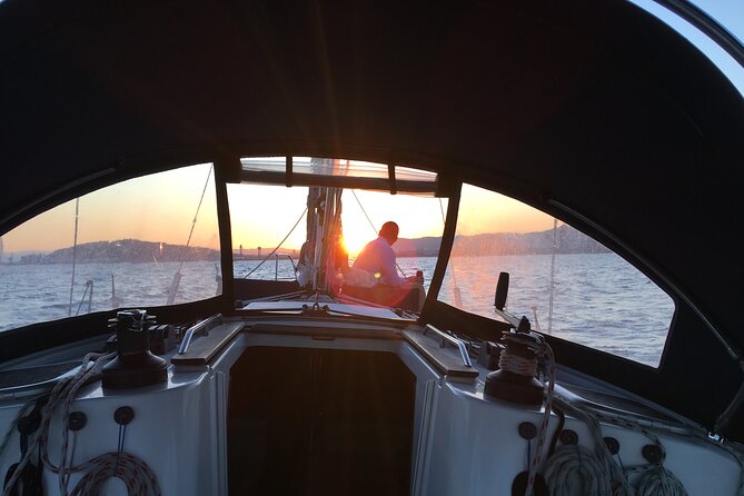 Sunset boat trip with open bar of cava (local champagne) - Optional Swimming Stop During the Sailing