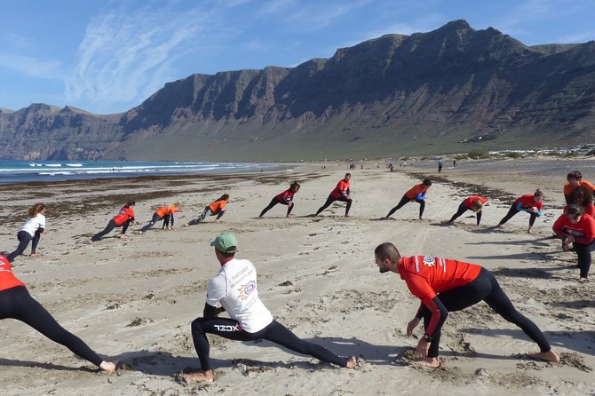 Surf class in Famara 9:15-12:00 or 11:45-14:30 (2h class) - The Role of Experienced Guides in Your Surf Lesson