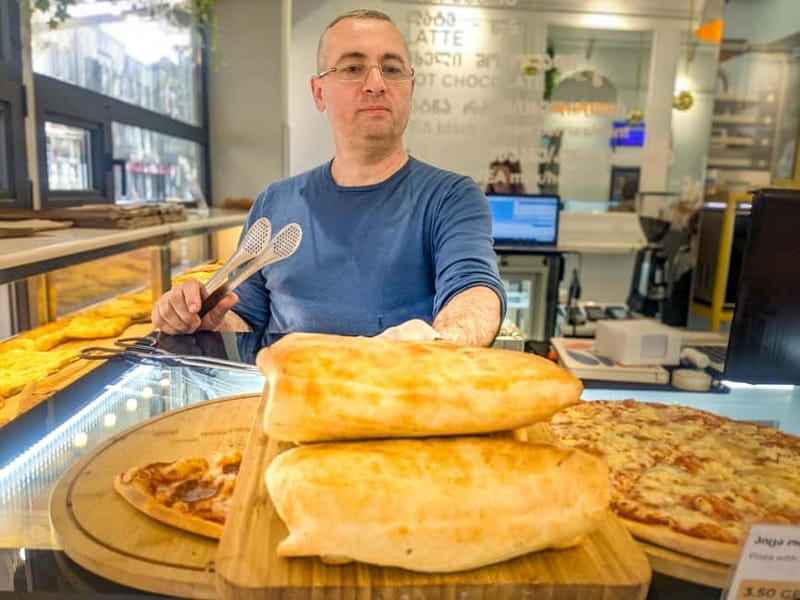 Tbilisi: Eat Like a Local  Street Food Tour w/ 10 Tastings - Enjoying a Classic Georgian Street Snack from a Busy Kiosk