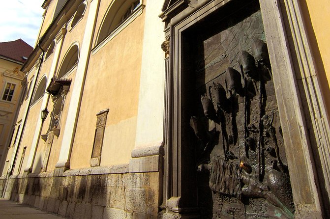 The Ljubljana's Cathedral Tour (St. Nicolas Church) - The Heavy Bronze Doors: Artistic Marvel and Symbolism