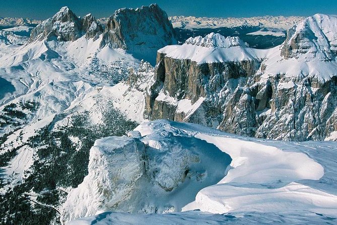 The most famous sledge slope in the Dolomites and a panoramic tour by car - Marvel at Carezza Lake and the Historical Grand Hotel