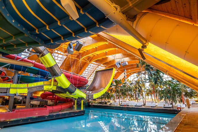 Therme Bucharest: Entry Ticket and Round-Trip Transfer - Inside Therme Bucuresti: Pools, Saunas, and Water Slides