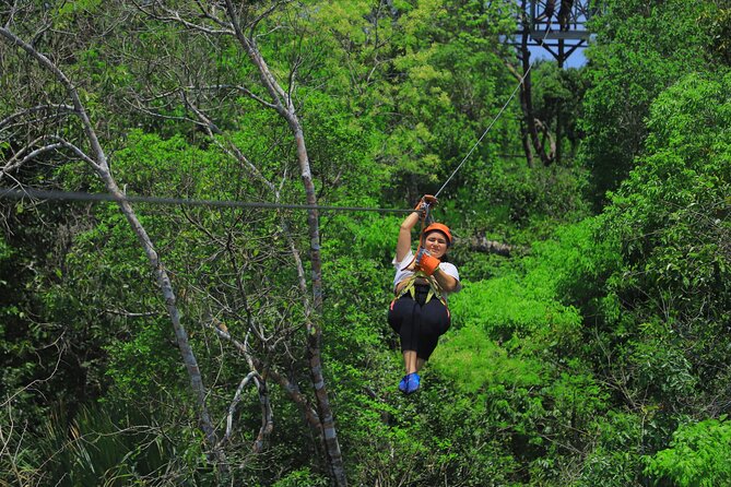 Top ATV's in Mexico includes Cenote, Ziplines, snack & transport. - Ziplining through the Jungle Canopy