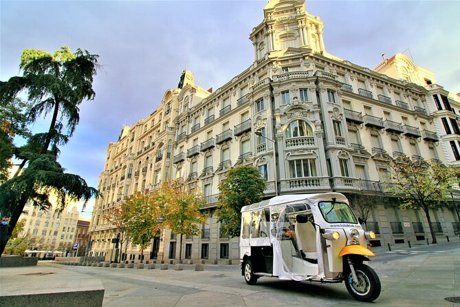 Tour of Historic and Modern Madrid with a guide in a yellow tuk tuk - Key Points