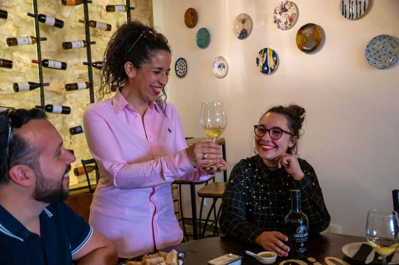 Treasures of Lisboa : Alfama Food Tour with 18 Tastings - Visiting a 14th-Century Wall and Tasting Exceptional Portuguese Wine