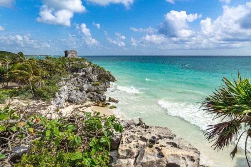 Tulum: Highlights Tour with Cenote & Jungle Village. German Tour Guide. - Discover the Iconic Tulum Ruins Overlooking the Caribbean Sea