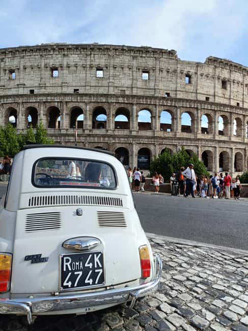 Under the lights of Rome: Tour in a Fiat 500 among the sunsets and lights of Rome - Visiting the Colosseum and Roman Forum by Night