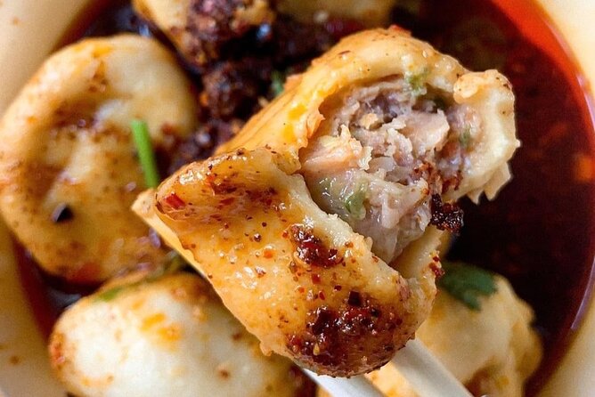 Upper East Side Food Tour | Tasty Tours NYC - Enjoying Spicy Dumplings at Xian Famous Foods